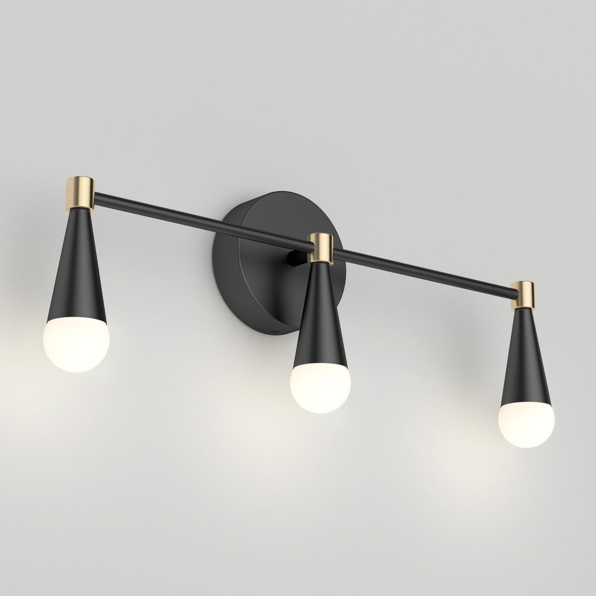 The Artika Wayden LED mid-century vanity light features 3 cone fixtures in black and gold, shown on a grey wall.