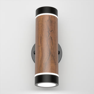 The Artika C7 indoor-outdoor LED wall light 3 CCT features a cylindrical wooden body, black metal ends, and circular white LED lights on the top and bottom, shown mounted on a white wall.