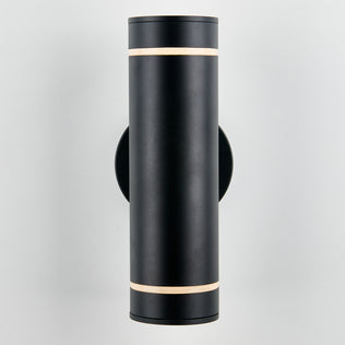 The Artika C7 indoor-outdoor wall light is a modern cylindrical black fixture with slim illuminated bands at the top and bottom, mounted on a light-colored wall—perfect for versatile lighting needs.