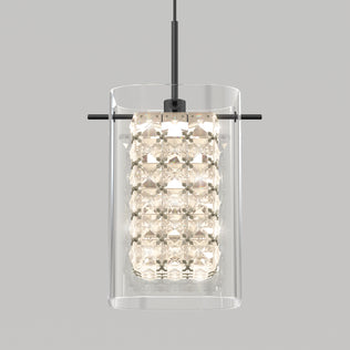 The Artika Crystal Cube 1-light LED pendant features a clear cylindrical glass shade and inner faceted crystals suspended from a black rod, shown against a plain gray background.