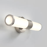 A modern wall-mounted light fixture with a cylindrical frosted glass shade and metallic accents, emitting a soft white glow against a light gray wall.
