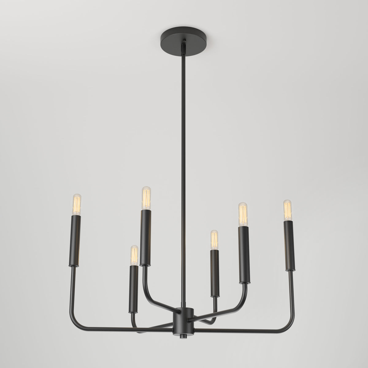A modern black metal chandelier with six exposed light bulbs, each at the end of a straight arm, suspended from a long rod against a plain white ceiling and background.
