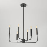 A modern black metal chandelier with six exposed light bulbs, each at the end of a straight arm, suspended from a long rod against a plain white ceiling and background.