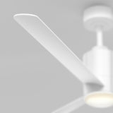 Close-up of a modern white ceiling fan blade against a light gray background, with part of the fan’s motor housing and ceiling attachment visible.