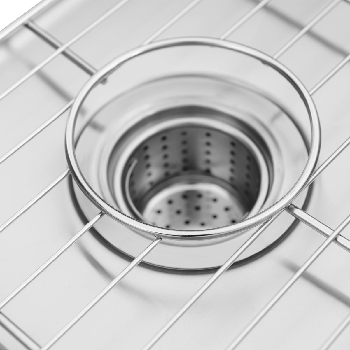 Close-up of the Artika Neoflow 31 in. single bowl stainless steel workstation sink, featuring a removable strainer and protective wire grid. Its sleek, reflective design offers both style and functionality.