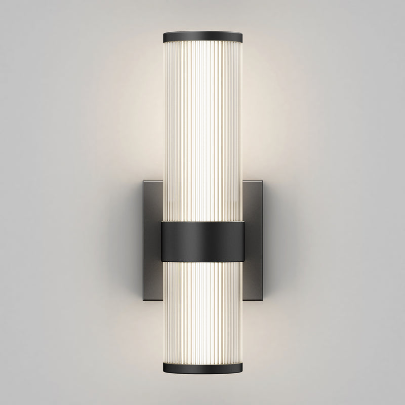 The Artika Mirado modern LED wall sconce 5 CCT features two vertically aligned frosted ribbed glass shades on a matte black square backplate, offering soft, even light and versatile style.