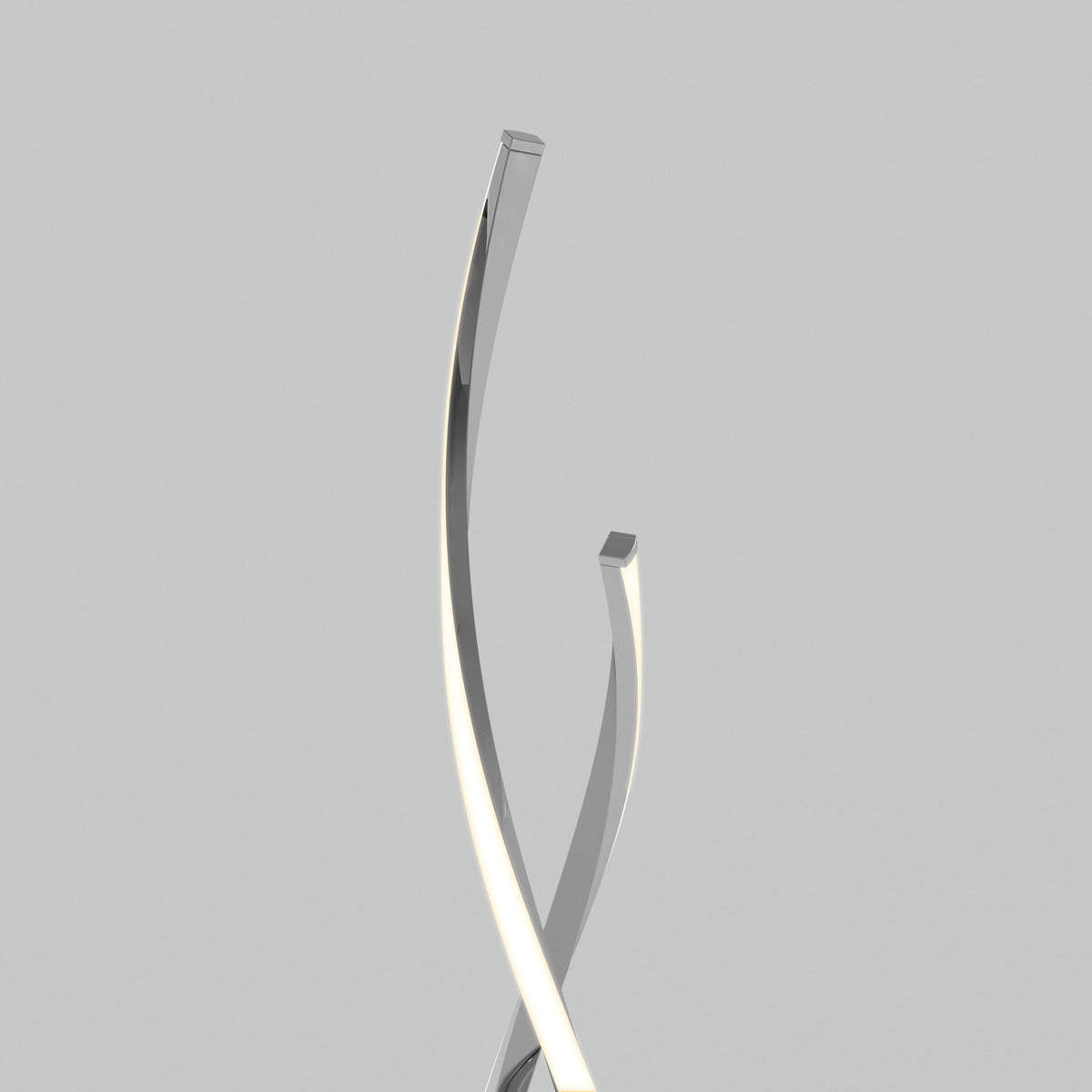 The Artika Swirl modern LED floor lamp features two sleek, metallic, curved rods that intersect and twist upward against a plain light gray background, with one rod emitting a soft white light along its edge.