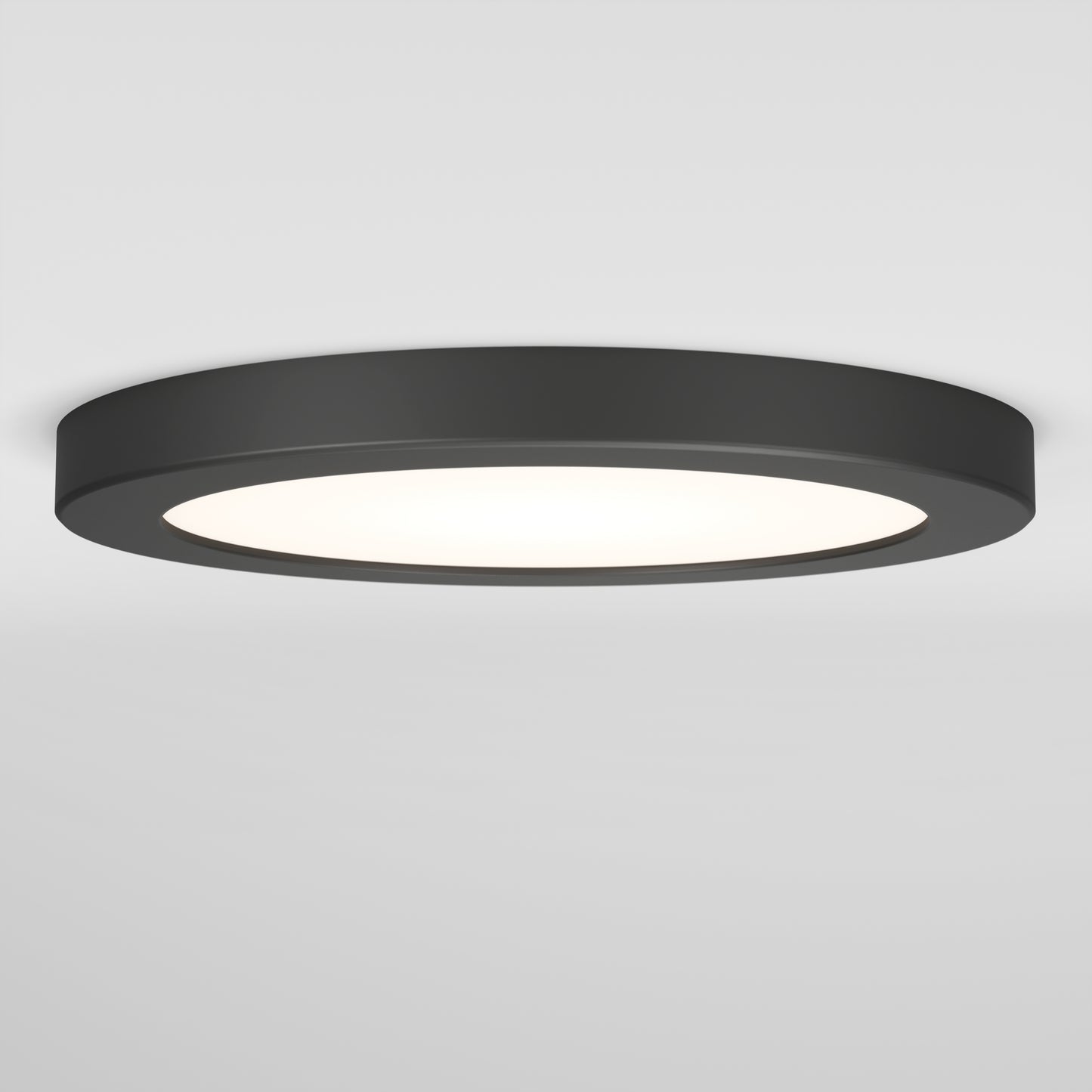 The Artika Europa Disk 7 in. LED modern flush mount light features a flat, round black design and offers 3 CCT options, emitting bright white light against a plain white ceiling and wall.