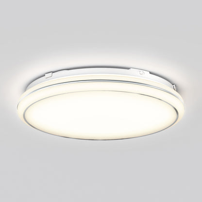 The Emina 13 in. LED flush mount light by Artika, featuring 3 CCT options, is a modern round white fixture that emits a soft, bright glow and is shown mounted on a plain light gray ceiling.