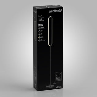 Black packaging box for the Artika Leni dimmable LED modern floor lamp, featuring a picture of the lamp, details like 50,000-hour lifespan, 700 lumens brightness, 3000K color temperature, and the Artika logo on a gray background.