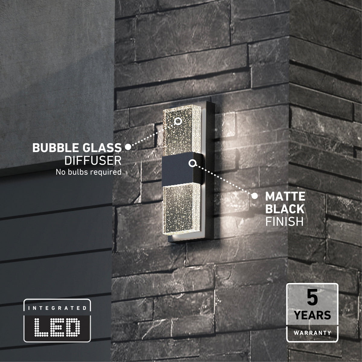 A modern outdoor wall light with a bubble glass diffuser and matte black finish is mounted on a dark stone wall. Text highlights integrated LED and a 5-year warranty.