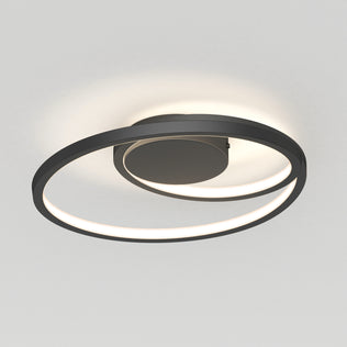 The Artika Salto LED flush mount light features a circular spiral design in matte black with a built-in LED strip, installed on a white ceiling to emit a soft, diffused glow.