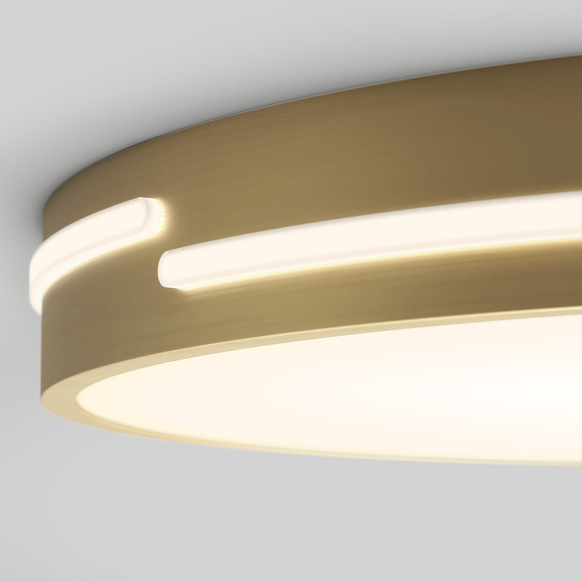 Close-up of the Artika Delray 15.7 in. LED modern flush mount light, featuring a circular design with brushed gold finish and built-in 5 CCT LED strips, emitting a soft warm glow and mounted on a white ceiling.