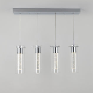 The Artika Essence 4-light LED pendant features four cylindrical glass shades suspended by thin wires with chrome accents, shown against a plain light gray background.