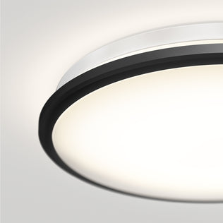 Close-up of the Artika Vera 13 in. Modern LED Flush Mount Ceiling Light with dimmable soft white glow, black & white frame on a white ceiling.