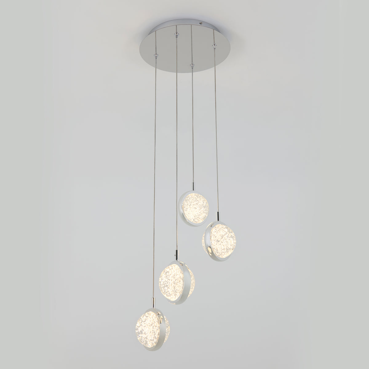 The Artika Avalon 4-light LED pendant features four textured, glowing round pendants suspended at varying lengths from a circular base for a modern ceiling lighting solution.