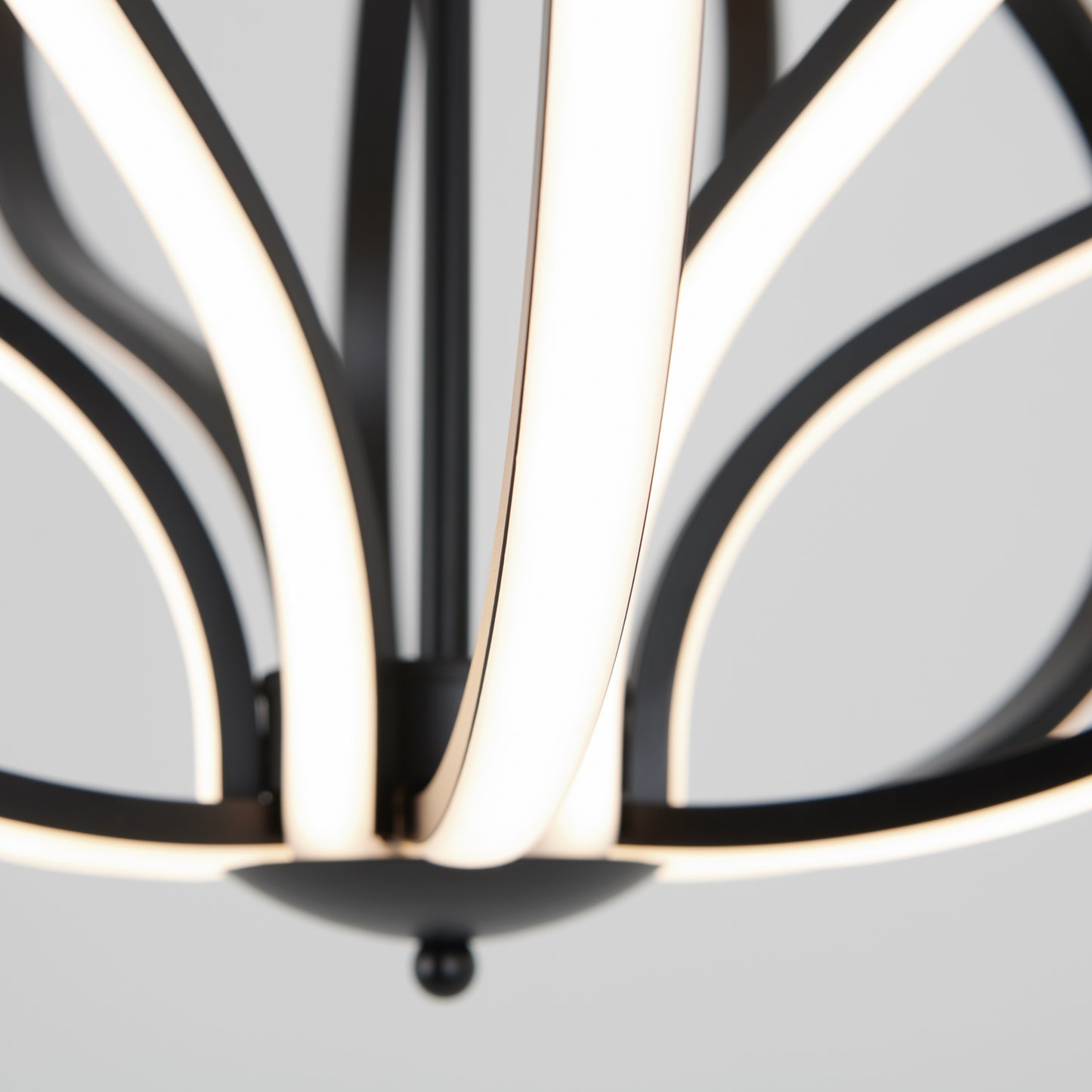Close-up of the Meridian LED pendant light by Artika, featuring curved black metal arms and integrated LED strips for a sleek, contemporary style against a light background.