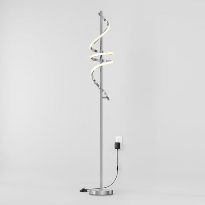 The Artika Coda modern LED floor lamp 5CCT features a spiral LED design, dimmable lighting, and a round metallic base. Its minimalist arched style plugs into a wall outlet and is shown against a plain white background.