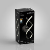 A rectangular Artika product box featuring the DNA LED wall sconce, showing a spiral, DNA-inspired light fixture against a black background with white and silver text and product details.