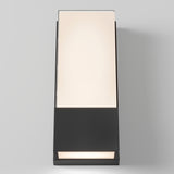 A modern wall-mounted light fixture with a rectangular design, featuring a black base and a frosted white panel that emits a soft glow. The light is positioned against a plain gray background.