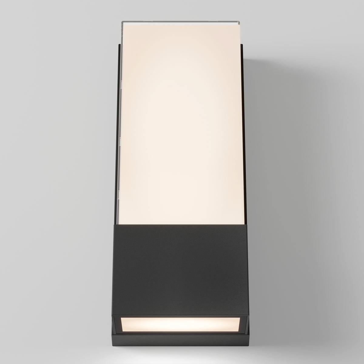 The Artika Dixon indoor-outdoor LED wall light features a modern rectangular design with a black base and frosted glass top, casting a soft warm glow against a plain light gray background.
