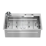 A modern stainless steel kitchen sink with a deep rectangular basin, a built-in drain grid, a round strainer in the top left corner, and holes for faucet installation at the back.