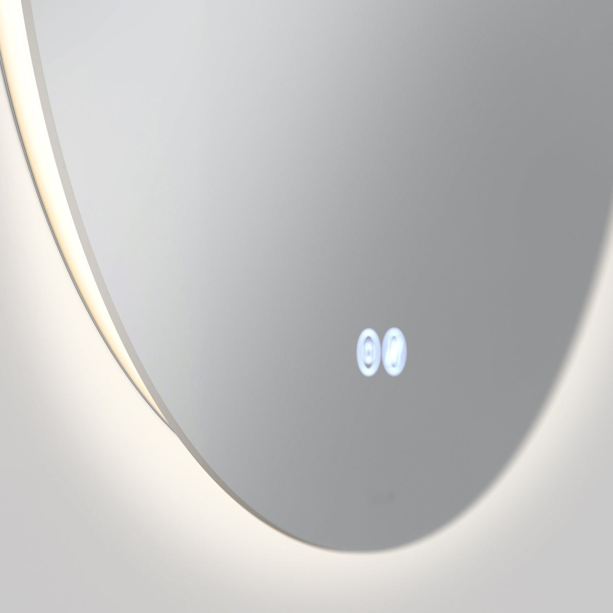 A close-up of the Artika Raya 24 in. LED mirror 3 CCT with defogger, featuring two glowing touch-sensitive icons on its round illuminated surface, set against a plain light background.
