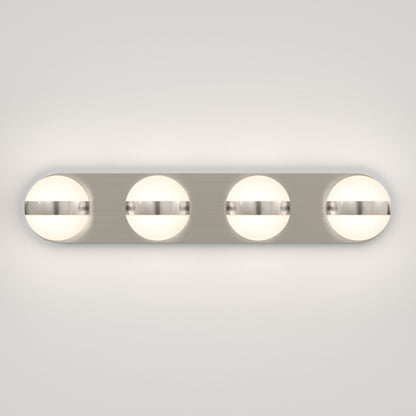 A modern wall-mounted light fixture with four round, frosted glass globes evenly spaced on a rectangular metallic base, emitting soft white light against a plain background.