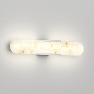 The Artika Selena LED bathroom vanity light 3 CCT features a modern, cylindrical design and casts a soft, warm glow.