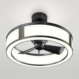 A modern ceiling fan with three black blades enclosed by a circular, illuminated LED light fixture mounted on a white ceiling.