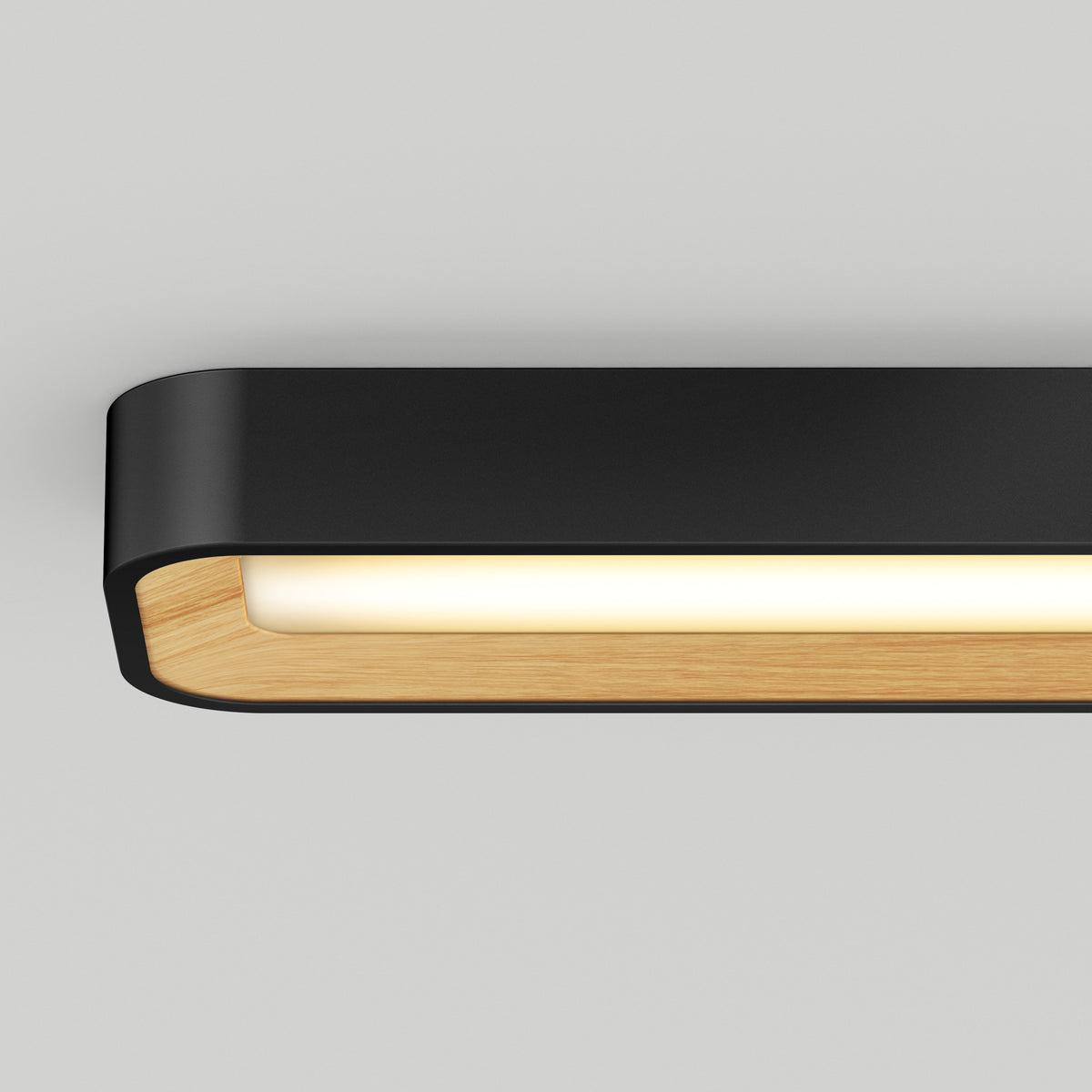 A modern rectangular wall light fixture with a black outer frame, wooden inner lining, and a soft white glow, mounted on a light grey wall.