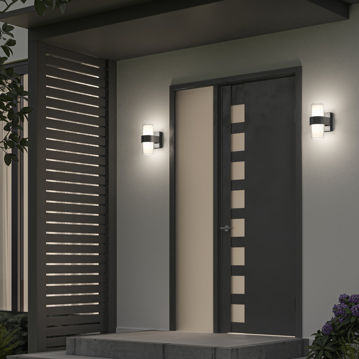 A modern front door with staggered rectangular windows is flanked by two Artika Colton modern LED indoor-outdoor wall lights; a slatted privacy screen sits to the left, with steps and plants in the foreground.