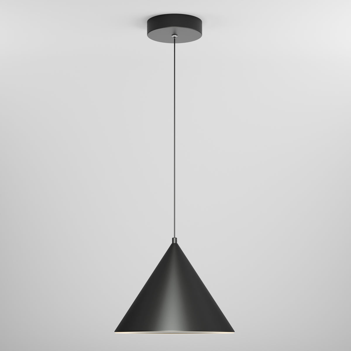 A modern black pendant light with a conical shade hangs from a thin cord attached to a round ceiling mount against a plain white background.